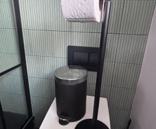 Bathroom toilet roll holder, bin and shower door squeegee