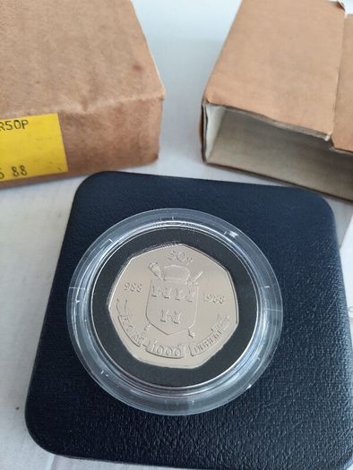 New 50p Millennium coin in original packaging