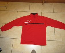 Errea  red sports top   size MED