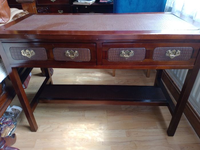 Wooden console table with faux crocodile skin detail