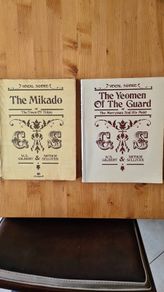 Vocal Score G. S. Music Books.1988. 2x . 1 X The Mikado. I X The Yeoman Of The Guard. Both By W. S. Gilbert & Arthur Sullivan. Large Volume Paperback In Good Condition.
