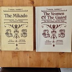 Vocal Score G. S. Music Books.1988. 2x . 1 X The Mikado. I X The Yeoman Of The Guard. Both By W. S. Gilbert & Arthur Sullivan. Large Volume Paperback In Good Condition.