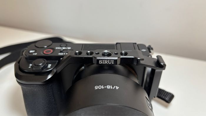 Sony ZVE-10 + Sony E 18-105mm f/4 lens (cage and 5 batteries)