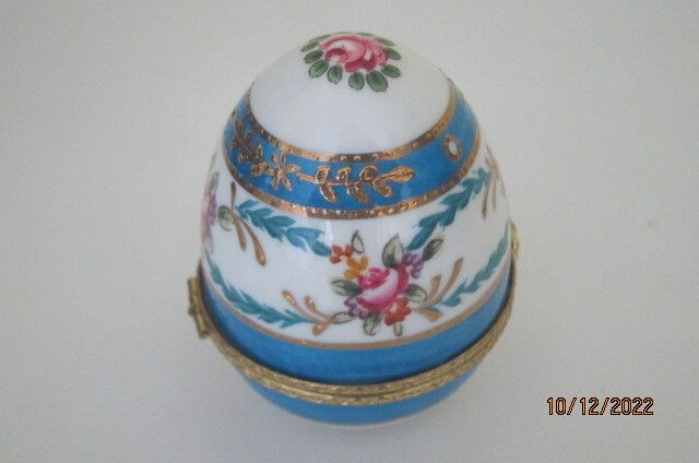 Beautifully painted ceramic egg trinket box