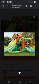 Inflatable bouncy castle with slide and pump