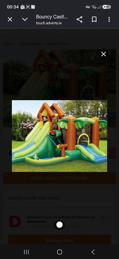 Inflatable bouncy castle with slide and pump
