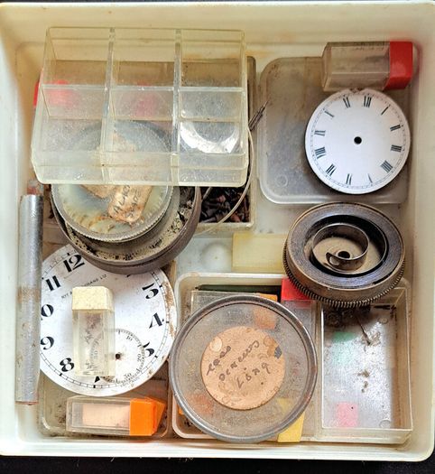 Boxes of miscellaneous watch parts