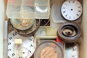 Boxes of miscellaneous watch parts
