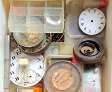 Boxes of miscellaneous watch parts