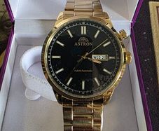 Brand new in the box gold plated Astron Hybrid watch