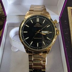 Brand new in the box gold plated Astron Hybrind watch