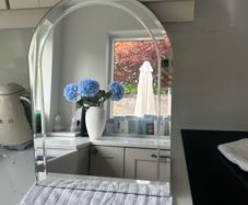 Arched bevel-edge mirror