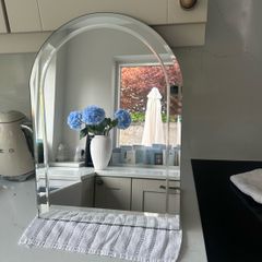 Arched bevel-edge mirror