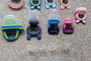 Assorted baby fruit feeders and teethers