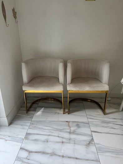 Cream and gold armchairs