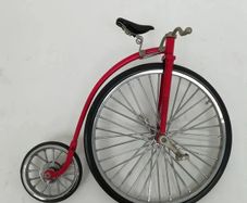 1:10 scale die-cast metal replica of a Red Penny-farthing bicycle.