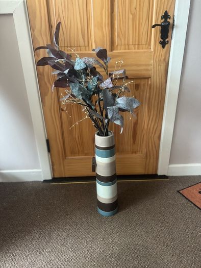 Vase with artificial flowers and lights