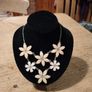 vintage floral piece necklace featuring white, petal-like elements. arranged in a daisy like pattern. Like new Image 2