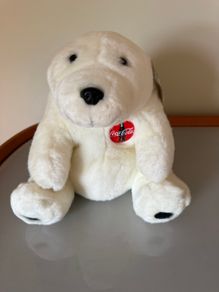 Vintage 1990s Coca-Cola polar bear plush toy featuring the classic red circular Coca-Cola logo