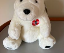 Vintage 1990s Coca-Cola polar bear plush toy featuring the classic red circular Coca-Cola logo