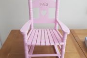 Pink wooden rocking chair