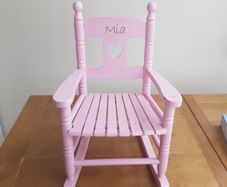Pink wooden rocking chair
