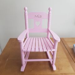 Pink wooden rocking chair