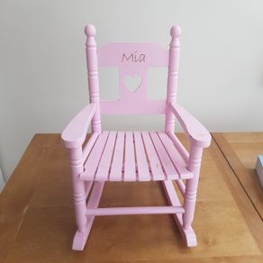 Pink wooden rocking chair