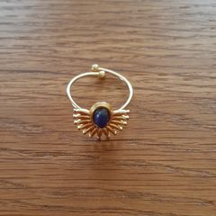 Very pretty golden fashion jewellery ring with blue stone