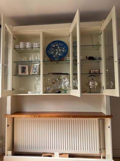 Radiator cover and display unit