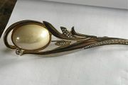 gold tone brooch