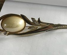 gold tone brooch
