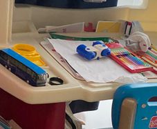 Toddler. playing desk with 2 pockets side storage very well kept