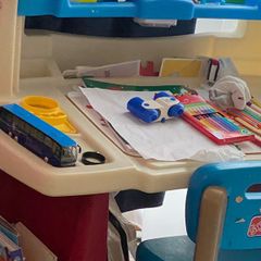 Toddler. playing desk with 2 pockets side storage very well kept