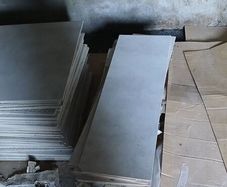 Wall and floor tiles and bathroom. Talll boy