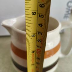 Vintage Carrigaline pottery jug. Brown, mustard yellow and white. Made in Ireland 5 inches tall.