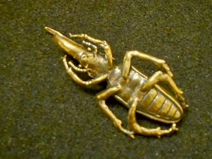 3 brass beetles.