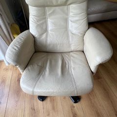 Cream leather armchair and footstool