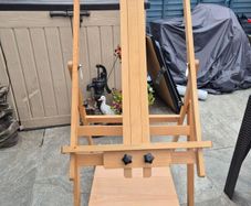 Easel along with 3 canvas