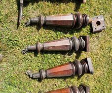 Antique mahogany piano legs with bronze casters