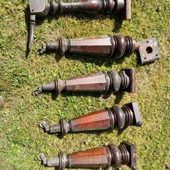 Antique mahogany piano legs with bronze casters