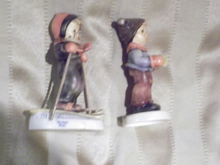 2 hummel figurines real hummel but are signed  ski heil skiar and for me