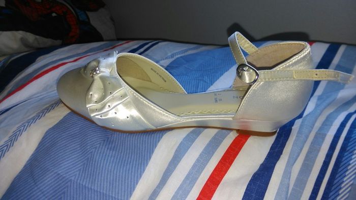 Brand new, never worn ivory satin wedge shoe with satin bow detail.