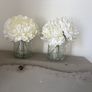 Pair of faux floral decorations with glass vases Image 4