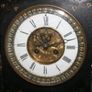 Victorian French Black Slate Mantle Clock (Very large and heavy) with bronze ornamentation Oversized. Open escarpment slate plate Roman numerals. Circa 1890s. Accented with Trojan head. Flanked by two Hellenistic ladies heads on sides. Rose cartouche mask Image 8