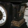 Victorian French Black Slate Mantle Clock (Very large and heavy) with bronze ornamentation Oversized. Open escarpment slate plate Roman numerals. Circa 1890s. Accented with Trojan head. Flanked by two Hellenistic ladies heads on sides. Rose cartouche mask Image 10