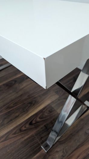 Modern white desk with chrome cross legs