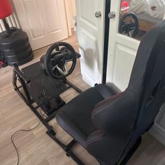 Gaming chair with wheel and pedals