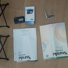 Guitar Accessories and Susuki Books 1 and 2