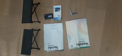 Guitar Accessories and Susuki Books 1 and 2